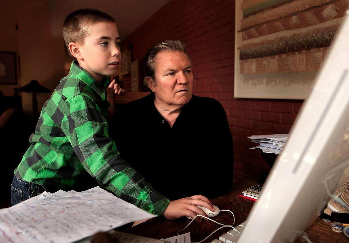 Ralph Barbieri is guided around the internet by his 11-year-old son, Tate at their Novato, Ca. home, Ca. on Saturday October 1, 2011.