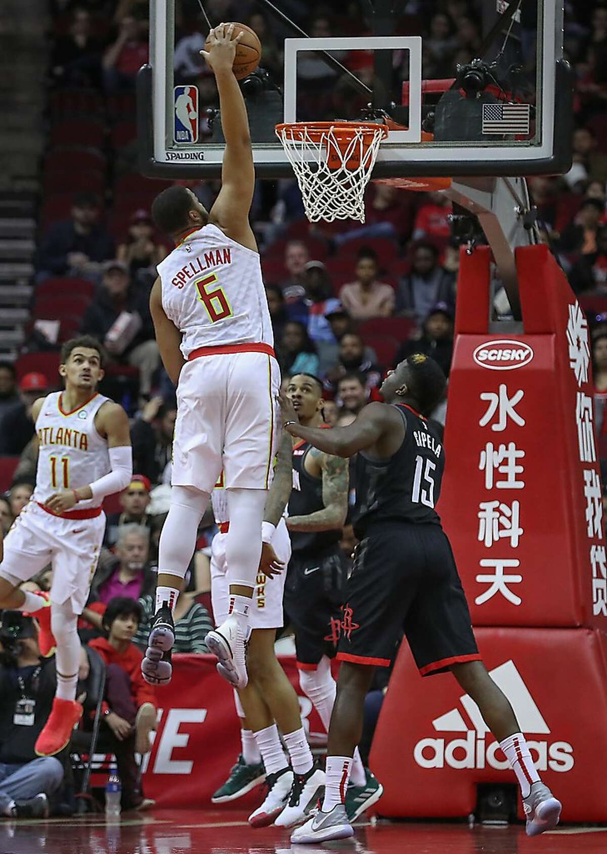 Atlanta Hawks forward Omari Spellman (6) dunks for two during the first half of an NBA basketball game at Toyota Center on Monday, Feb. 25, 2019, in Houston.