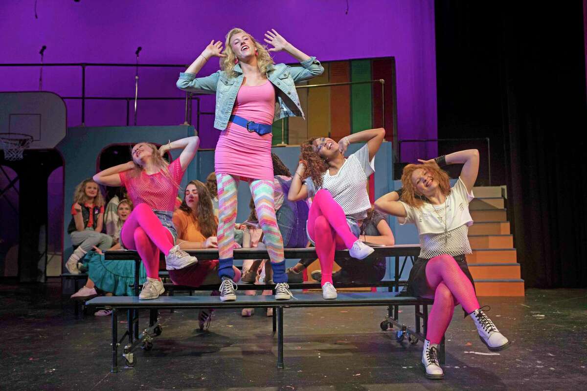 A scene from Staples Players' upcoming production of "Back to the 80's." From left, Staples High School students Maisy Boosin, Mia Kobylinski, AnnaMaria Fernandez and Camille Foisie.
