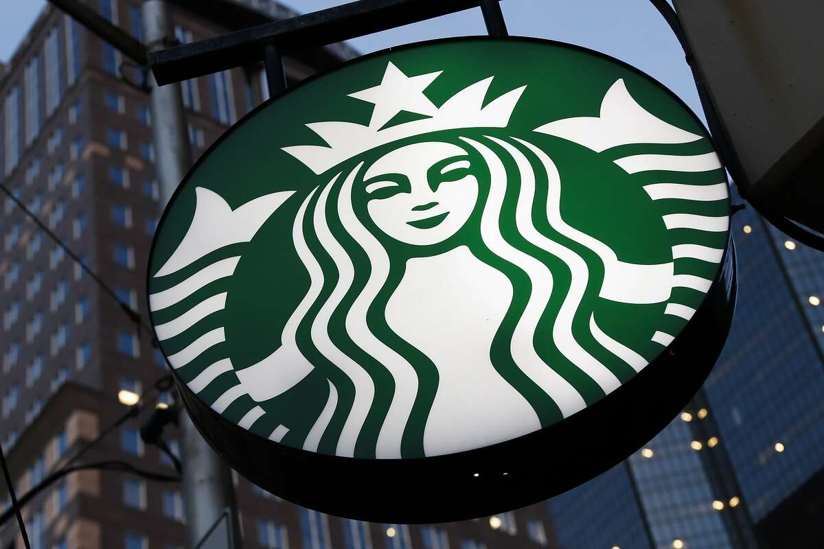 FILE - This June 26, 2019, file photo shows a Starbucks sign outside a Starbucks coffee shop in downtown Pittsburgh. The coffee chain will quit selling The New York Times, Wall Street Journal or Gannett papers like USA Today in September, citing “changing customer behavior” in a Friday, July 12, statement. Starbucks has sold The Times since 2000 and other papers since 2010. (AP Photo/Gene J. Puskar, File)