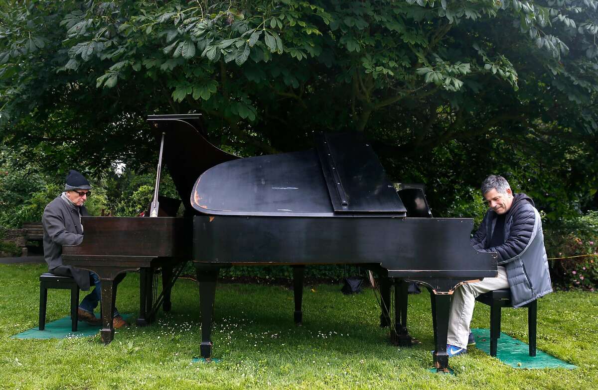 Dean Mermell (left) and Bobby Franz perform an impromptu duet at the 5th annual Flower Piano event at the S.F. Botanical Garden in San Francisco, Calif. on Friday, July 12, 2019. Twelve pianos are available throughout the garden at Golden Gate Park for the public to play and enjoy scheduled performances by professional musicians through July 22.