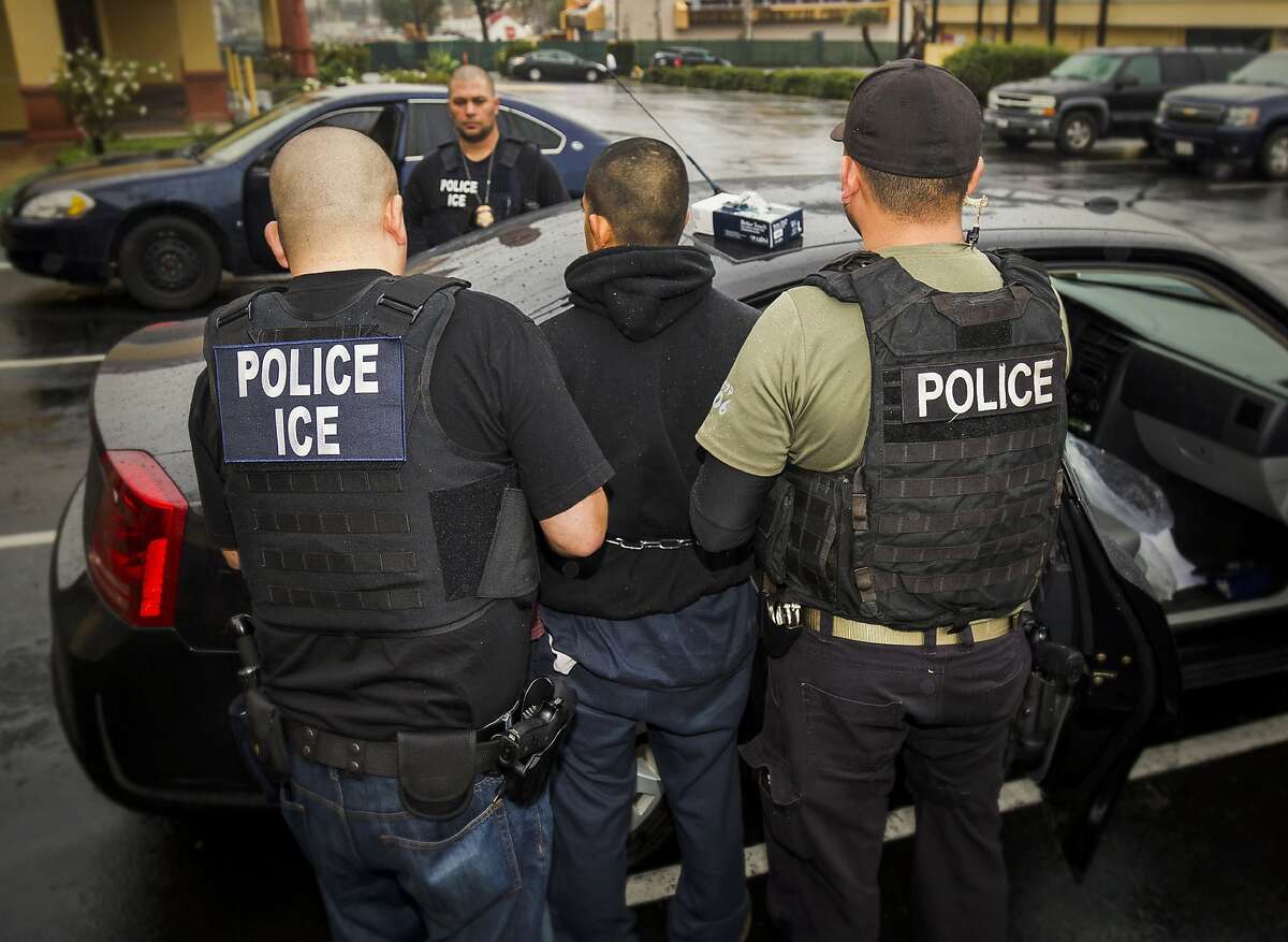 FILE - In this Tuesday, Feb. 7, 2017, photo released by U.S. Immigration and Customs Enforcement, foreign nationals are arrested during a targeted enforcement operation conducted by U.S. Immigration and Customs Enforcement (ICE) aimed at immigration fugitives, re-entrants and at-large criminal aliens in Los Angeles. A federal appeals court has given the Trump administration a rare legal win in its efforts to crack down on sanctuary cities. In a 2-1 decision Friday, July 12, 2019, the 9th U.S. Circuit Court of Appeals said the Justice Department was within its rights to give priority status for multimillion-dollar community policing grants to departments that agree to cooperate with immigration officials. (Charles Reed/U.S. Immigration and Customs Enforcement via AP, File)