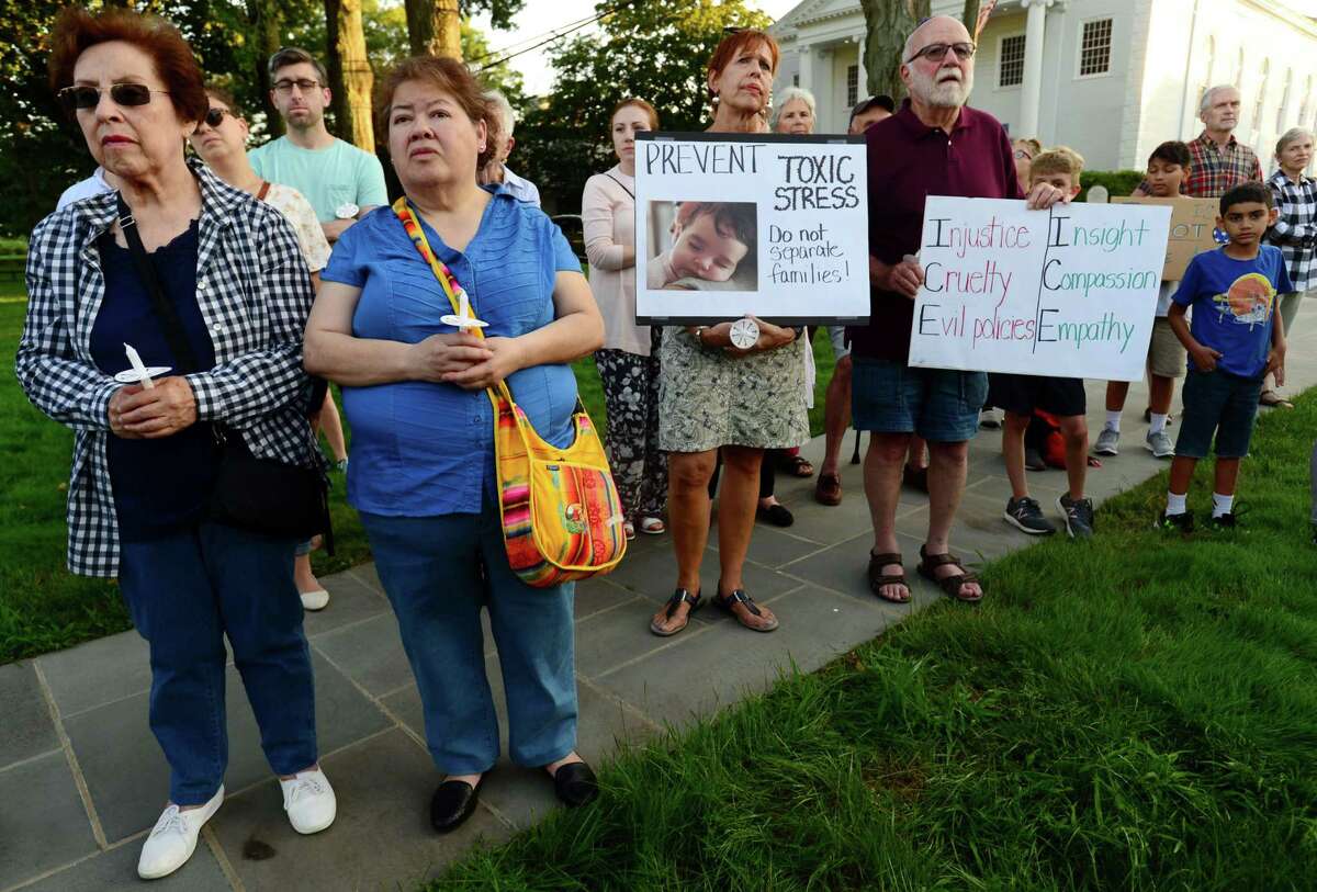 The Norwalk DTC organizes a vigil on the Norwalk Green in protest of the Trump administration's border policies Friday, July 12, 2019, in Norwalk, Conn. The Vigil was held in conjunction with similar demonstrations around Fairfield County.