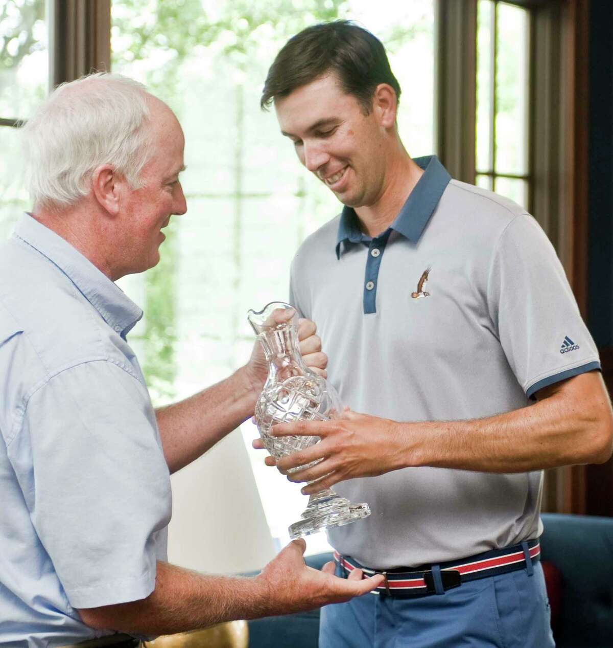 President of the Connecticut State Golf Association Mike Moraghan presents the trophy to Adam Rainaud at the 2016 Connecticut Open.