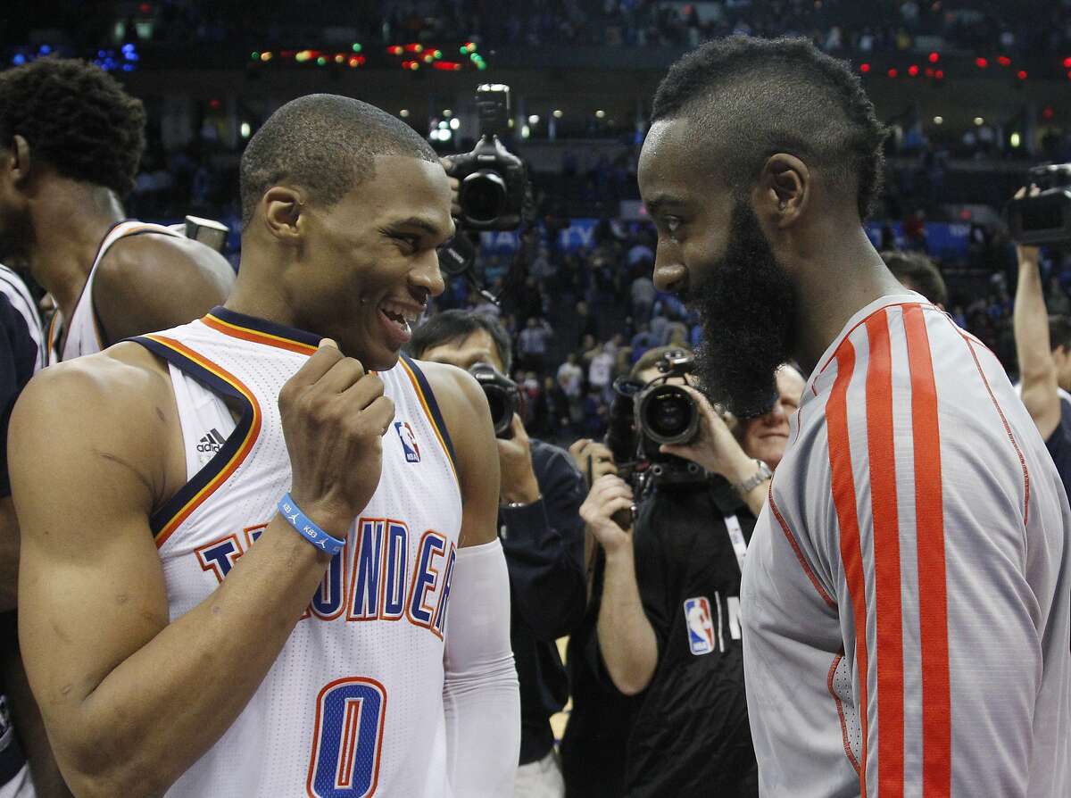 Oklahoma City Thunder guard Russell Westbrook (0) and Houston Rockets guard James Harden, right, talk following their an NBA basketball game in Oklahoma City, Wednesday, Nov. 28, 2012. Oklahoma City won 120-98. (AP Photo/Sue Ogrocki)