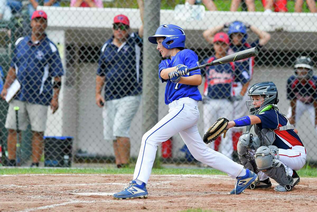 Darien's Aidan Elders follows his two run double in the third inning against Stamford North in the District 1 Little League championship game at Drotar Park in Stamford, Conn. on July 13, 2019. Darien defeated Stamford North 12-2 (5 innings).