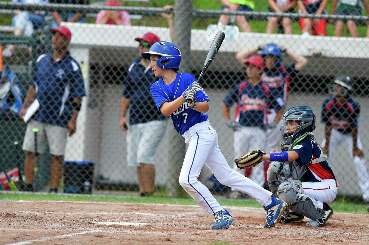 Darien's Aidan Elders follows his two run double in the third inning against Stamford North in the District 1 Little League championship game at Drotar Park in Stamford, Conn. on July 13, 2019. Darien defeated Stamford North 12-2 (5 innings).