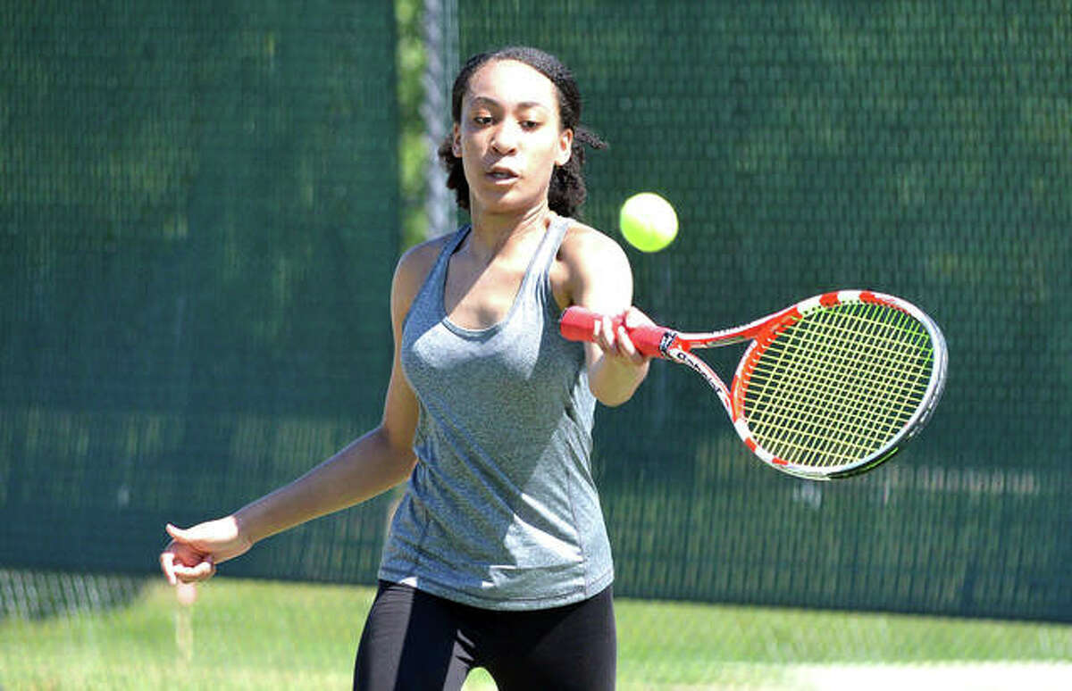 Arianna Winters of Edwardsville makes a forehand return on Saturday during a match in girls’ 16 and 18 singles in the Edwardsville Junior NET Tournament at the EHS Tennis Center.