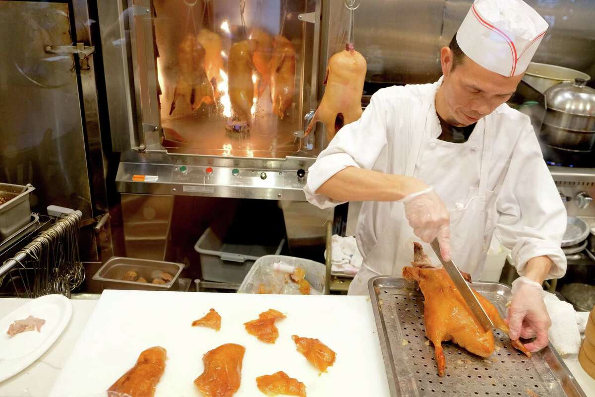 Customers can see the ducks being roasted and carved in the exhibition kitchen at Bamboo House in Humble.