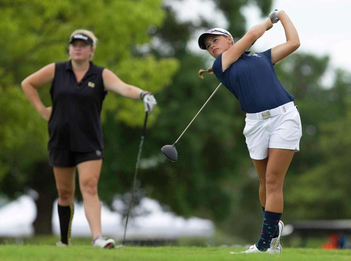 Elina Sinz of Katy Tompkins hits off the 10th tee box as Amelia McKee of Klein Oak looks on during the final round of the Class 6A UIL State Golf Championships at Legacy Hills Golf Club, Tuesday, May 22, 2018, in Georgetown.