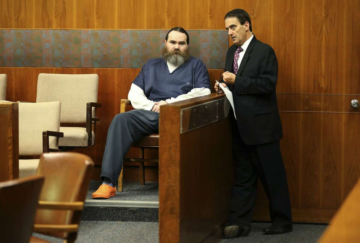 Shaun Gallon speaks with his attorney Deputy Public Defender Jeff Mitchell during a sentencing hearing, Monday, July 15, 2019, in Santa Rosa, Calif. Gallon sentenced to life in prison for killing an engaged couple from Ohio while they were camping on a Northern California beach in 2004. (Beth Schlanker/The Press Democrat via AP)