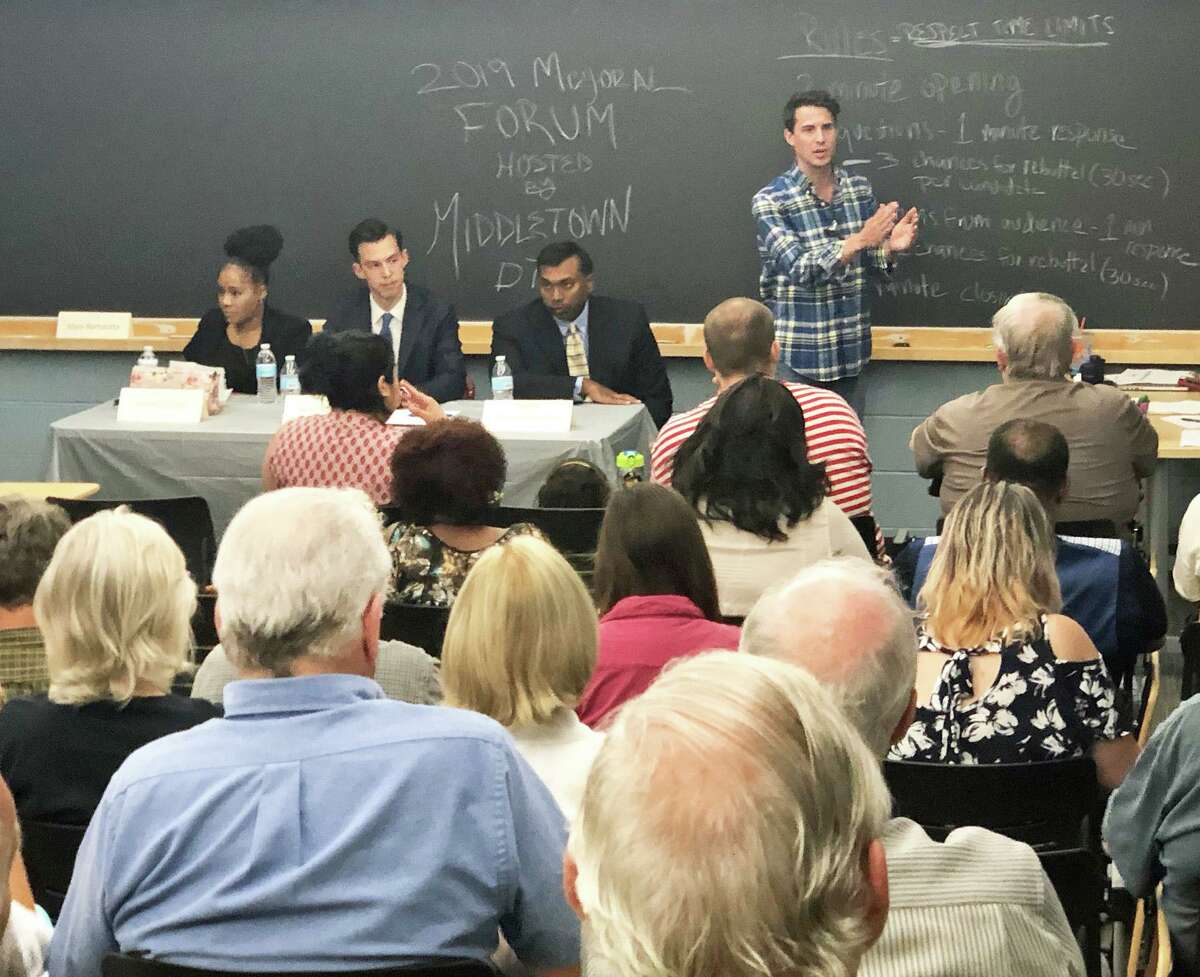 Wesleyan University was the location of the Middletown Democratic Town Committee mayoral forum July 13. DTC Chairman and Common Councilman Robert Blanchard, far left, speaks to those gathered with (from left) candidates Valeka Clarke, Ben Florsheim and Geen Thazhampallath on the panel.