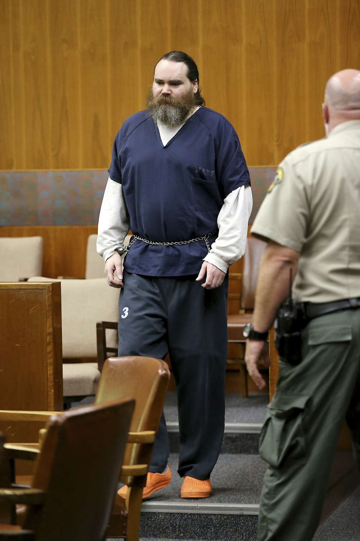 Shaun Gallon is escorted into a courtroom for a sentencing hearing, Monday, July 15, 2019, in Santa Rosa, Calif. Gallon sentenced to life in prison for killing an engaged couple from Ohio while they were camping on a Northern California beach in 2004. (Beth Schlanker/The Press Democrat via AP)