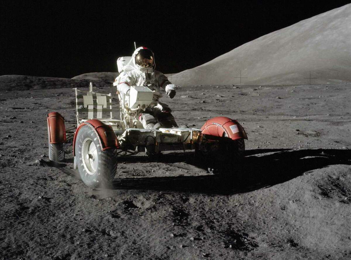 Astronaut Eugene A. Cernan, commander, makes a short checkout of the Lunar Roving Vehicle (LRV) on Dec. 11, 1972 during the early part of the first Apollo 17 extravehicular activity at the Taurus-Littrow landing site. This view of the "stripped down" rover is prior to loading up. Equipment later loaded onto the rover included the ground-controlled television assembly, the lunar communications relay unit, hi-gain antenna, low-gain antenna, aft tool pallet, lunar tools and scientific gear. This photograph was taken by scientist-astronaut Harrison H. Schmitt, lunar module pilot. The mountain in the right background is the east end of South Massif. While astronauts Cernan and Schmitt descended in the Lunar Module "Challenger" to explore the moon, astronaut Ronald E. Evans, command module pilot, remained with the Command and Service Module in lunar orbit.