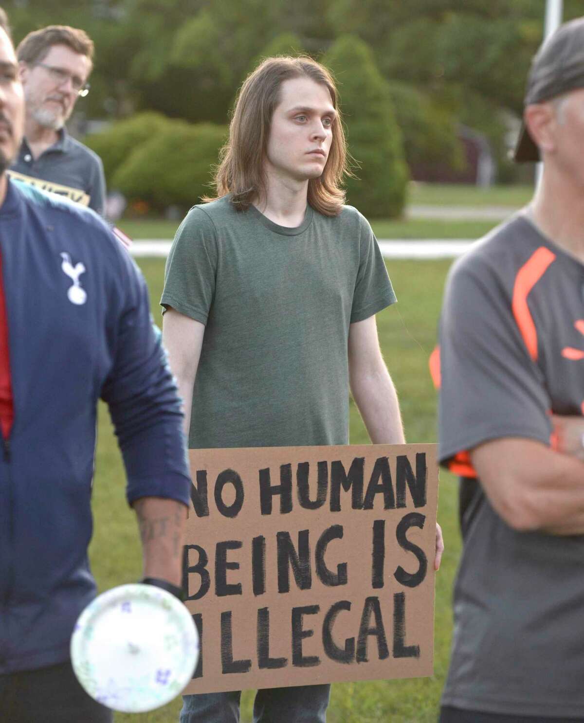 Ernie Johnson, of Bethel, listens to a speech at the "Light for Liberty:A Vigil to End Human Detention Camps" vigil held in Bethel and across the world. Friday evening. Friday, July 12, 2019, in Bethel, Conn.