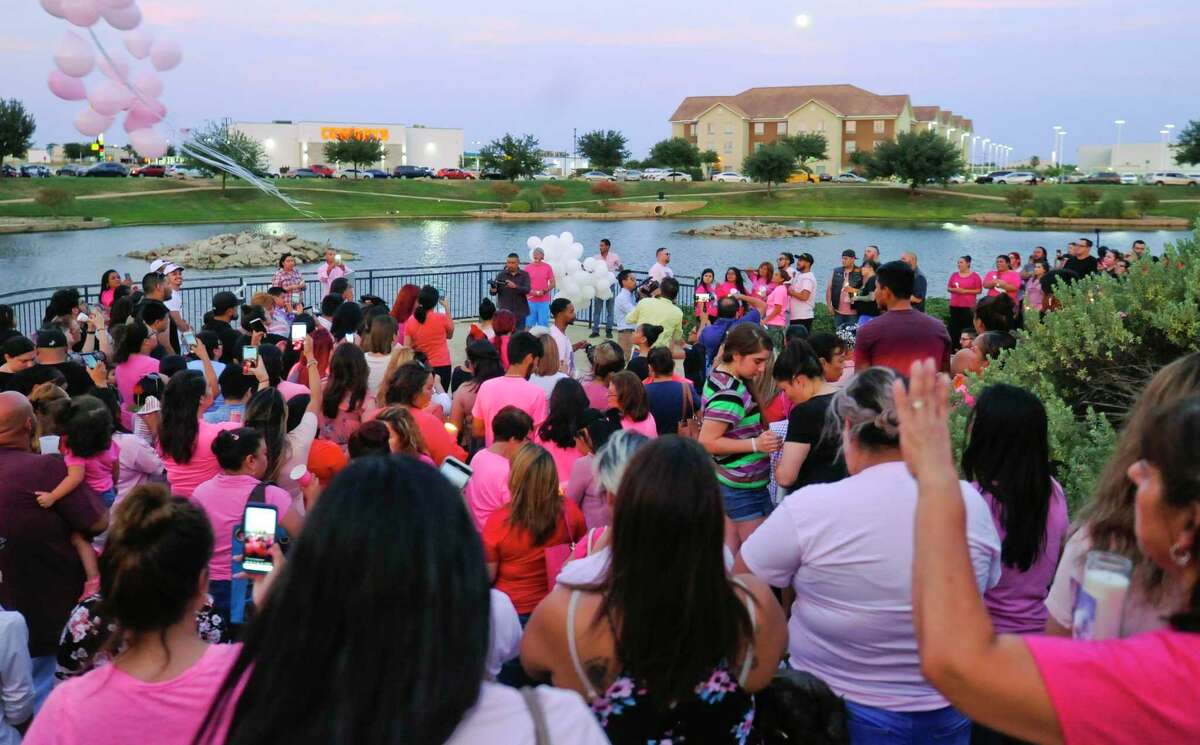 Friends of the late Myriam Camarillo gather to give their condolences to Camarillo's family at the Sames Arena Pond on Monday, July 15 during a candlelight vigil.