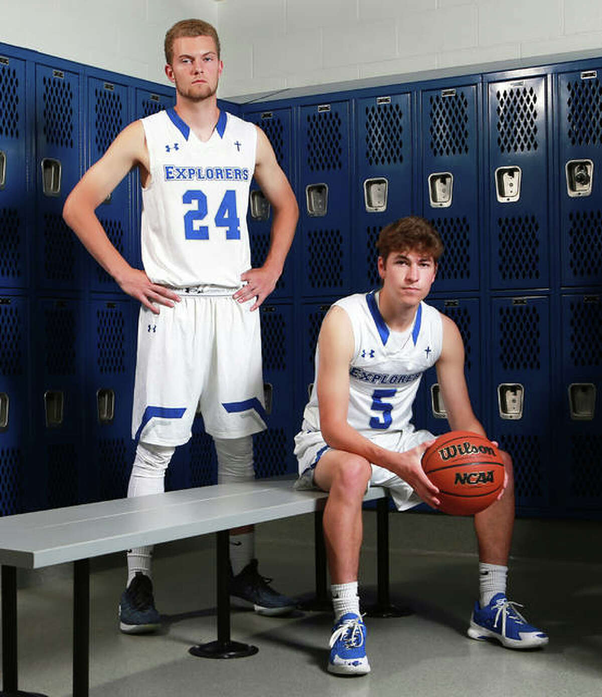 Marquette Catholic’s Nick Hemann (left) and Chris Hartrich are the 2018-19 Telegraph Small-Schools Boys Basketball Players of the Year. Both averaged 11 points a game as a senior to lead the Explorers to a 30-4 season.