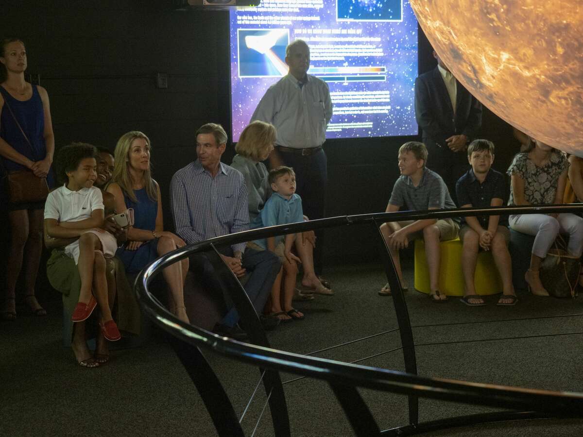 Families get a preview of the new Science on a Sphere display 07/15/19 at the Blakemore Planetarium. The 6 foot sphere, presented by Cimarex, utilizes four projectors to display multiple images of the earth as well as planets, moons and the sun. Tim Fischer/Reporter-Telegram