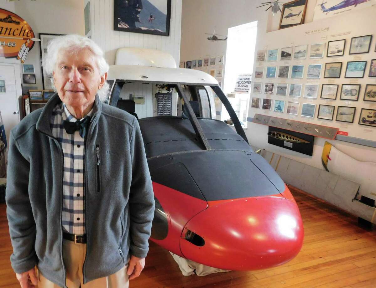 National Helicopter Museum founder Raymond Jankowich stands in front of the Sikorsky S-61 helicopter front section on display at the Stratford nonprofit institution.