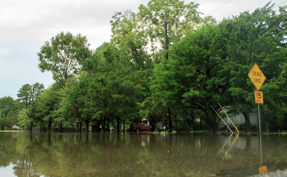 Roadways and yards are flooded after heavy rain from Tropical Depression Barry fell in Lake Charles, La. Monday, July 15, 2019. Barry was downgraded from a tropical storm on Sunday afternoon, but its torrential rains continued to pose a threat Monday. Much of Louisiana and Mississippi were under flash-flood watches, as were parts of Arkansas, eastern Texas, western Tennessee and southeastern Missouri. (Kirk Meche/Lake Charles American Press via AP)