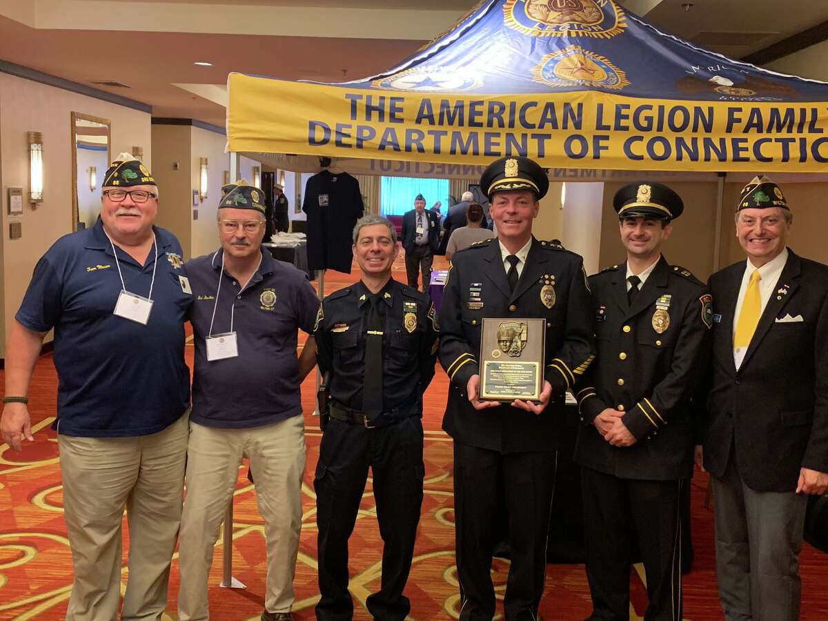From left, Post 86 Adjutant Tom Moore, Post 86 Judge Advocate Bud Boucher, Wilton Police Sgt. Arnault Baker, Capt. Rob Cipolla, Chief John Lynch, and Post 86 Commander Bill Glass at the awarding of Police Department of the Year Award at the 101st annual American Legion Department of Connecticut Convention, in Trumbull, July 12-14.
