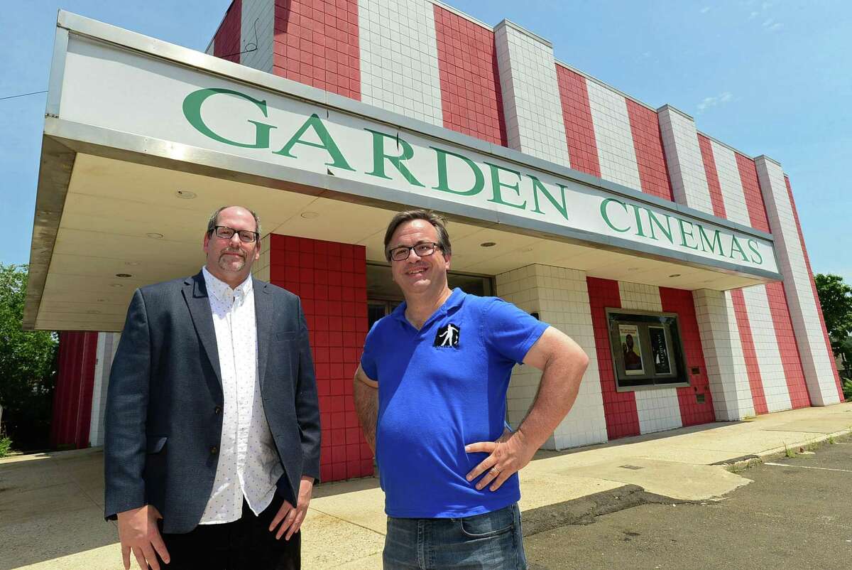 Wall Street Neighborhood Association members Marc Alan and Frank Farricker oustide The Garden Cinema on Isaac Street Tuesday, July 16, 2019, in Norwalk, Conn. A few days ahead of the public hearing on the proposed Wall Street Place development, which was knock down the Garden Cinema in order to build a parking structure, the Wall Street Neighborhood Association is campaigning to save the theater.