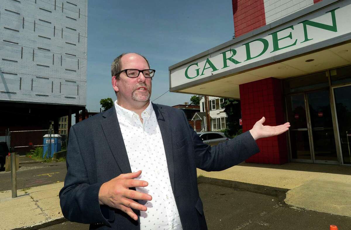 Wall Street Neighborhood Association member Marc Alan oustide The Garden Cinema on Isaac Street Tuesday, July 16, 2019, in Norwalk, Conn. A few days ahead of the public hearing on the proposed Wall Street Place development, which was knock down the Garden Cinema in order to build a parking structure, the Wall Street Neighborhood Association is campaigning to save the theater.