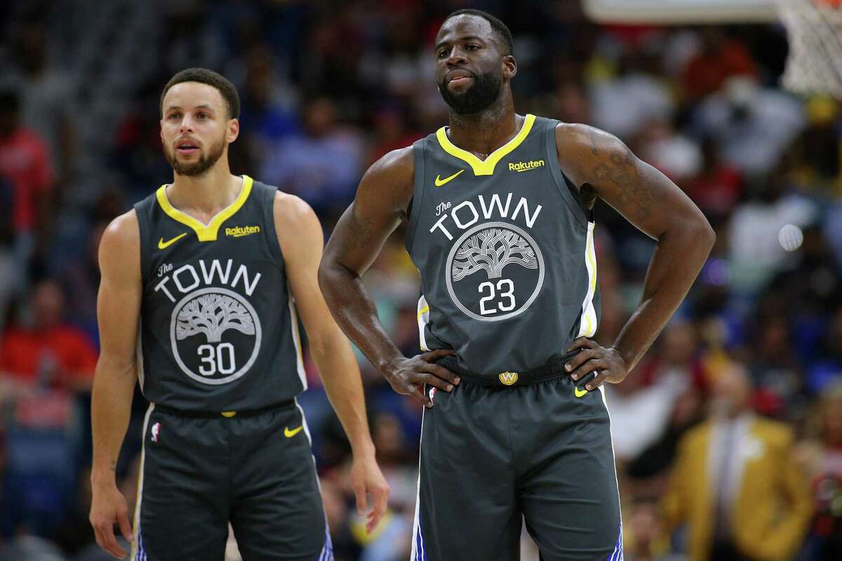 Stephen Curry #30 of the Golden State Warriors and Draymond Green #23 reacts during a game against the New Orleans Pelicans at the Smoothie King Center on April 09, 2019 in New Orleans, Louisiana.