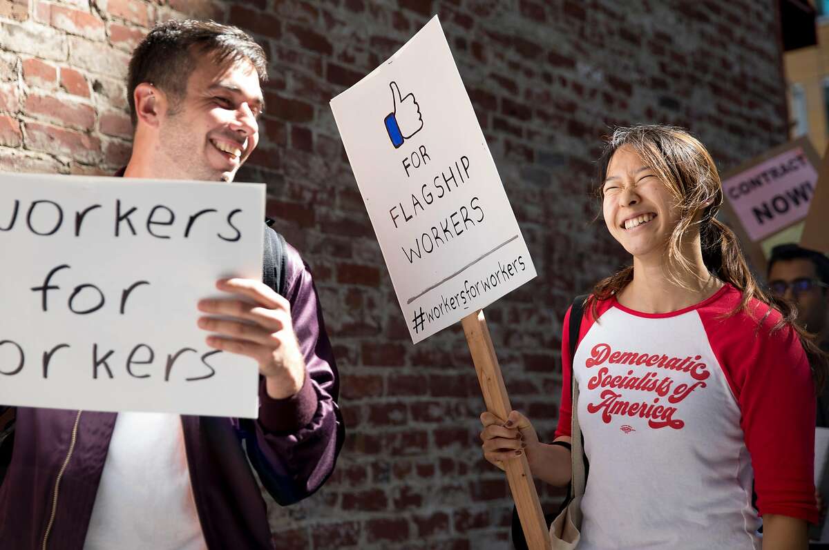 Former tech worker Wendy Liu (right) marches with Unite Here Local 2 members, Flagship cafeteria contract workers and supporters during a protest held outside of the Facebook offices in San Francisco, Calif. Tuesday, July 16, 2019.