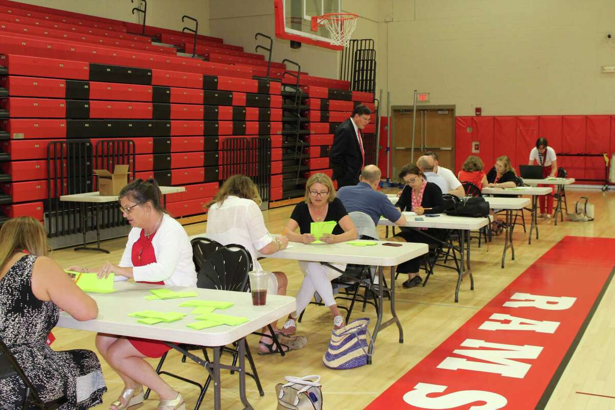 Counters tally votes in a five-way race for three Republican spots on November's Board of Education ballot during the GOP caucus at New Canaan High School Tuesday, July 16, 2019. Democrats caucused the same night and are trying to take one seat on the school board and one on the Town Council away from the Republican majority.
