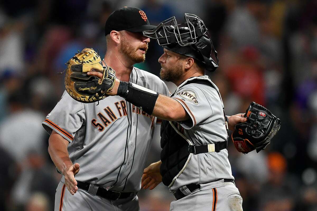 DENVER, CO - JULY 15: Stephen Vogt #21 of the San Francisco Giants celebrates a 2-1 win with Will Smith #13 of the San Francisco Giants before the bottom of the ninth inning during game two of a doubleheader against the Colorado Rockies at Coors Field on July 15, 2019 in Denver, Colorado. (Photo by Dustin Bradford/Getty Images)