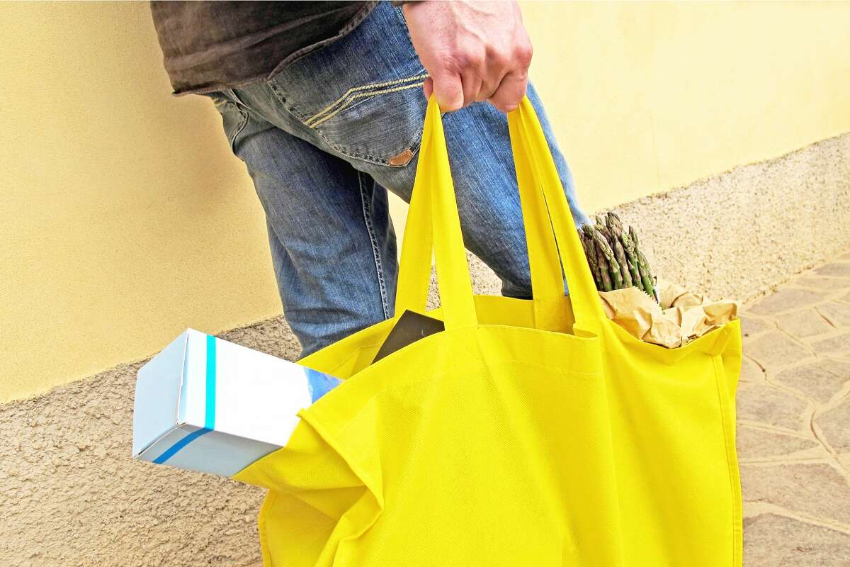 Reusable bags: To be considered one it has to have a "minimum lifespan of 125 uses, with a use equal to the ability to carry a minimum of 22 pounds over a distance of at least 175 feet; is hand- or machine-washable; has at least one strap or handle that is separately attached, does not stretch and is fastened to the bag."