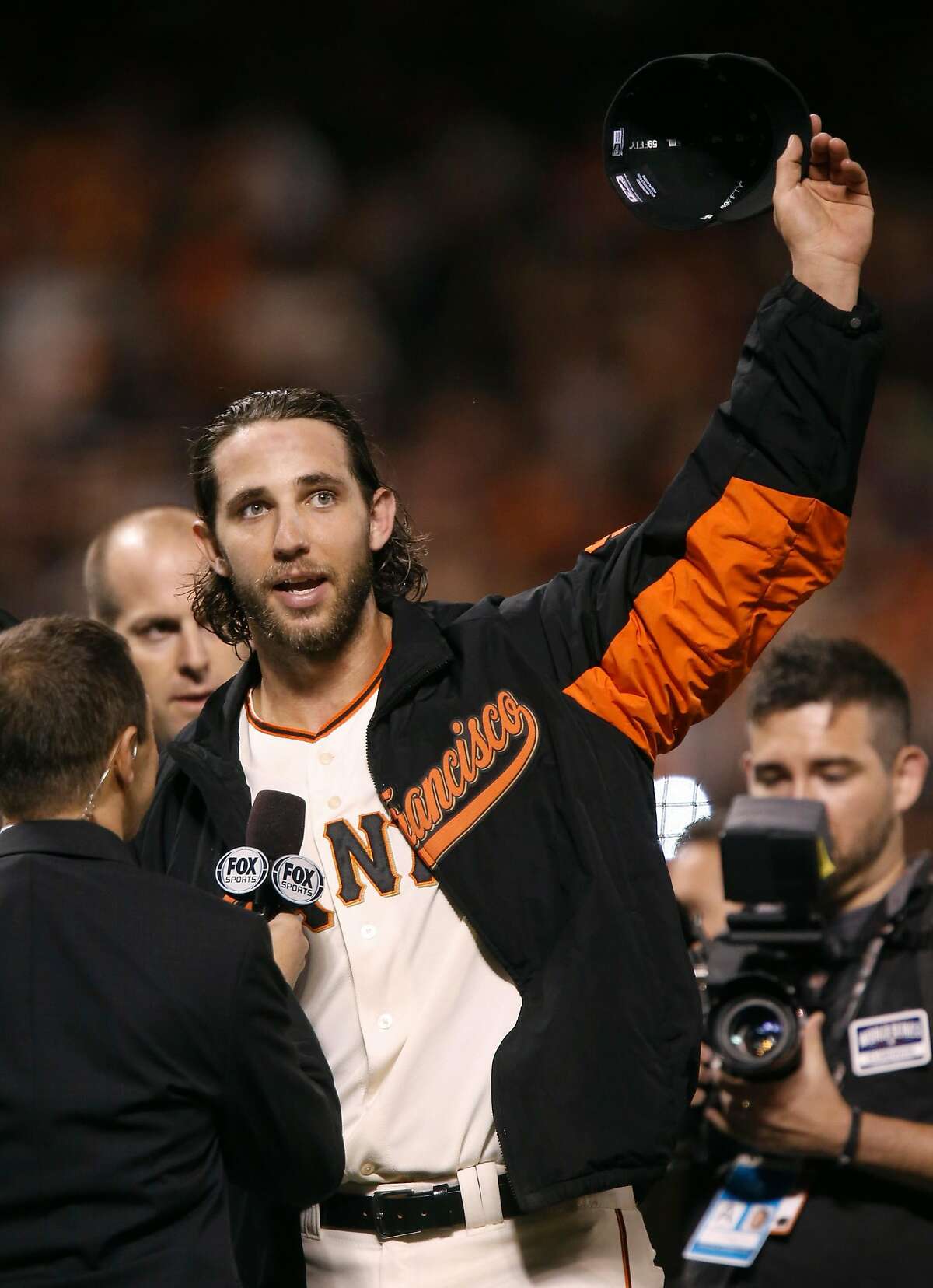 Giants Madison Bumgarner waves to the crowd after his winning 5 to 0 performance over the Kansas City Royals in Game 5 of the World Series at AT&T Park on Sunday, Oct. 26, 2014 in San Francisco, Calif.