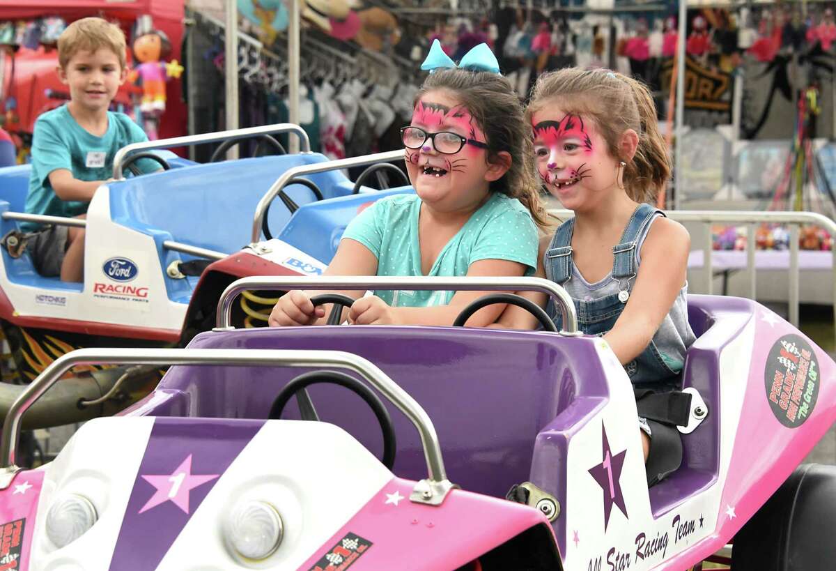 Six-year-old cousins Harliegh Hill, left and Grace Brisk, 6, both of Galway enjoy a bouncy car ride at the Saratoga County Fair on Wednesday, July 25, 2018 in Ballston Spa, N.Y. (Lori Van Buren/Times Union)