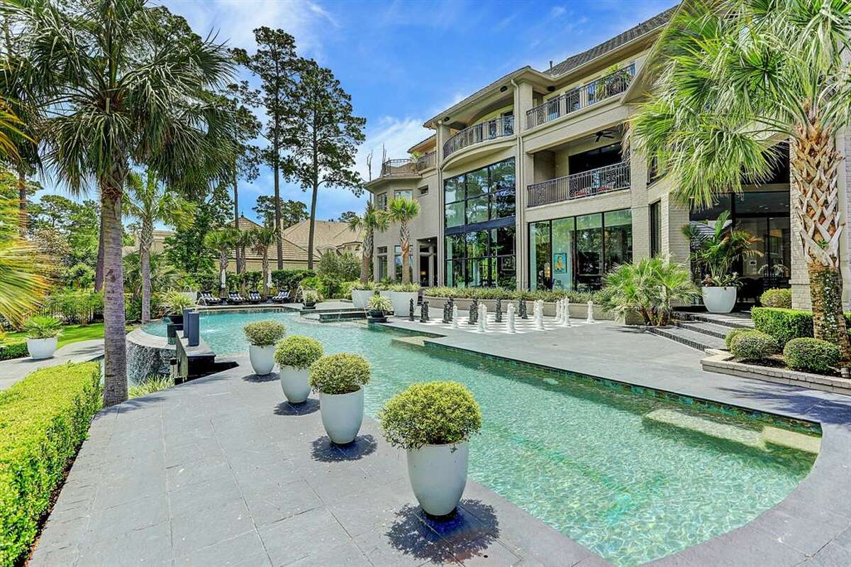 After a string of price reductions, the famous Woodlands house is now on the market for just under $7 million.