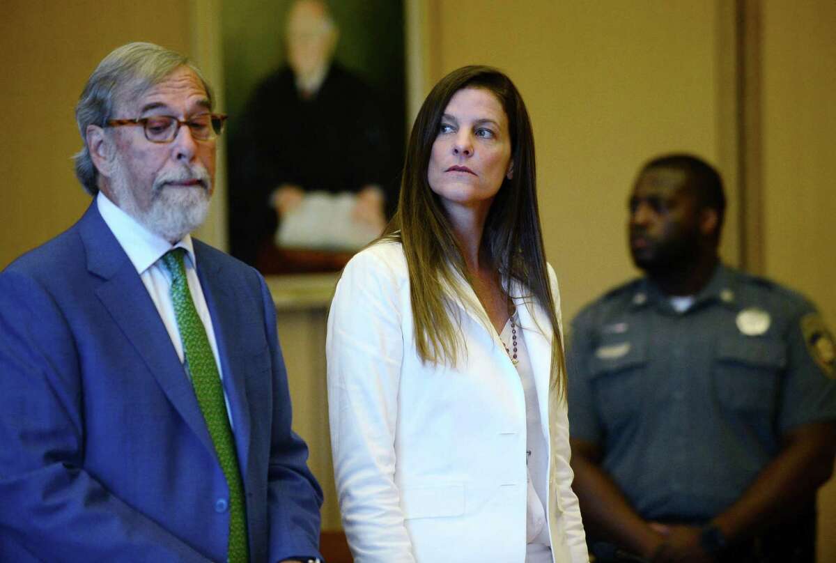 Michelle Troconis and her attorney Andrew Bowman, left, appear in state Superior Court in Stamford on July 18, 2019.