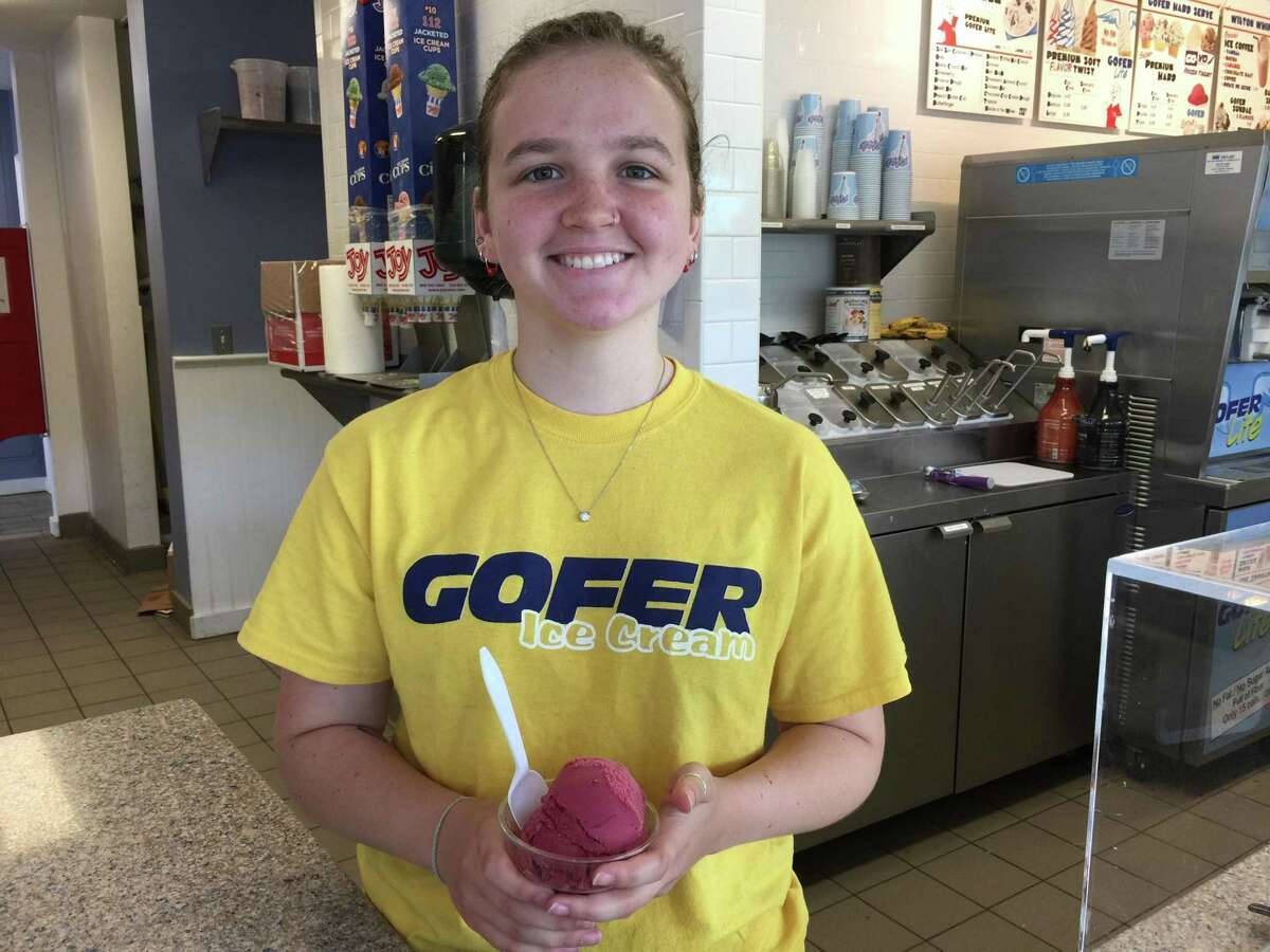 Alison Danvers serves up a cup of raspberry sorbet at Gofer Ice Cream Shop.