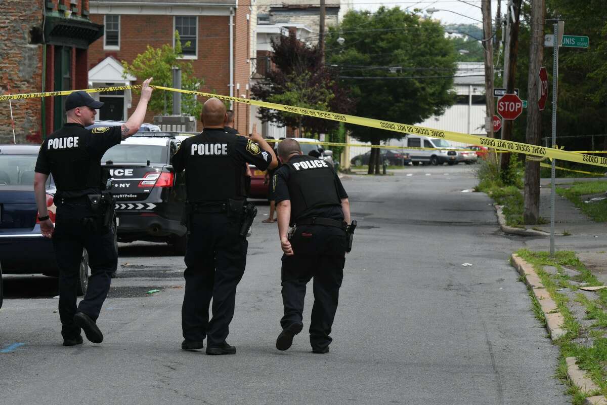 Albany police descended on the city's South End after a 3-year-old boy at a daycare center was hit in the arm by a stray bullet fire during a shootout between masked men who jumped out of a car and other men on a street.