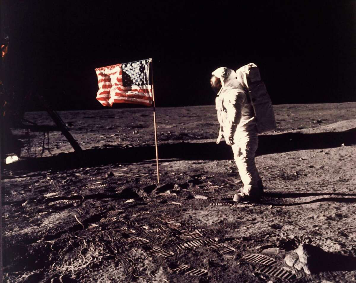 FILE - In this image provided by NASA, astronaut Buzz Aldrin poses for a photograph beside the U.S. flag deployed on the moon during the Apollo 11 mission on July 20, 1969. Television is marking the 50th anniversary of the July 20, 1969, moon landing with a variety of specials about NASA's Apollo 11 mission. (Neil A. Armstrong/NASA via AP, File)