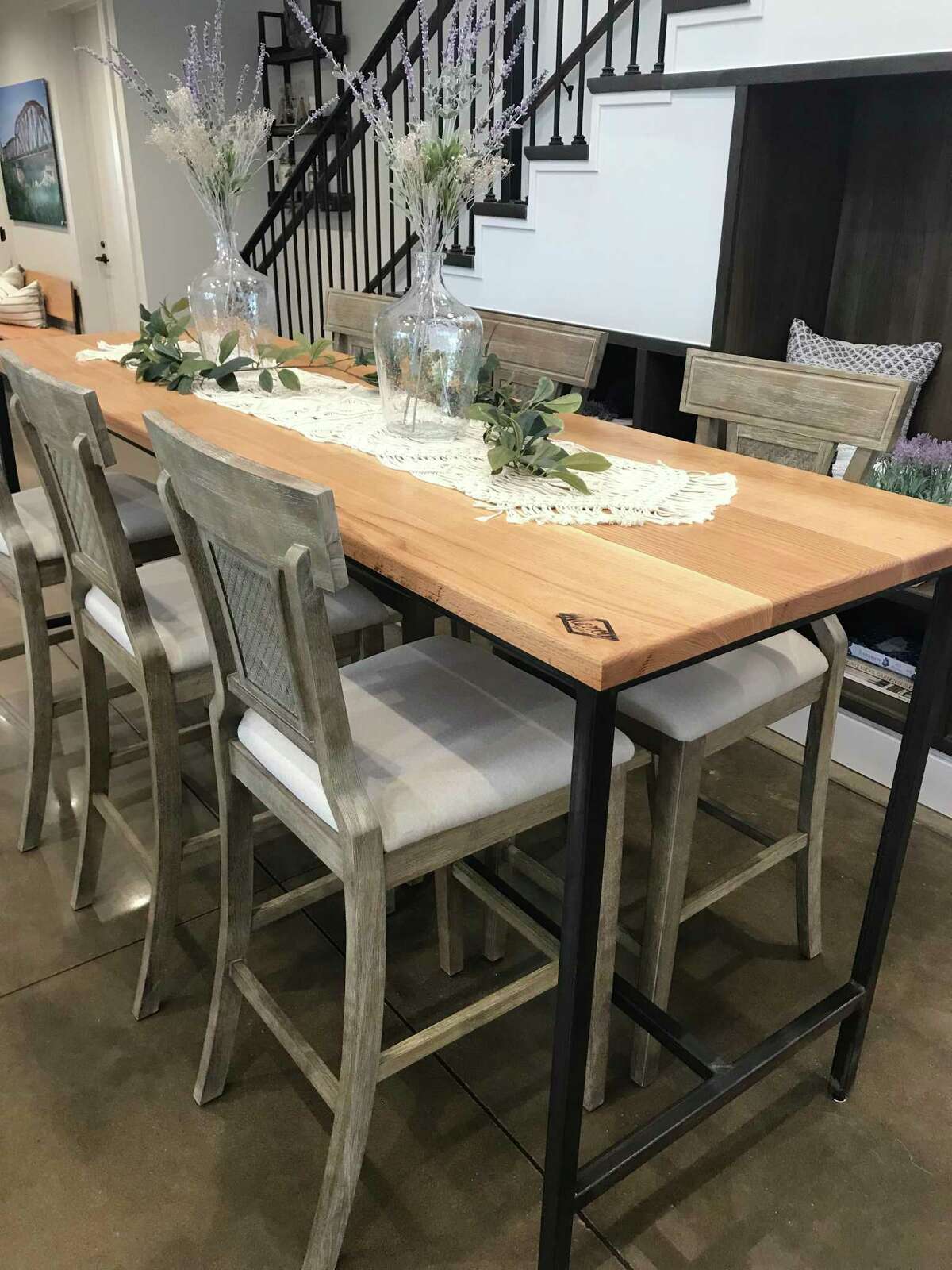 Veranda hired local social enterprise business Mercy Goods Co. to design and build a table and bench for The Cottage House, the community’s newly opened amenity center.