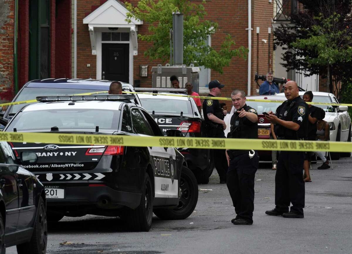 Police investigate the scene of a shooting on Third Avenue on Thursday, July 18, 2019, in Albany, N.Y. A 3-year-old boy was shot in the arm with a stray bullet fired during a shootout outside of a South End home. (Will Waldron/Times Union)