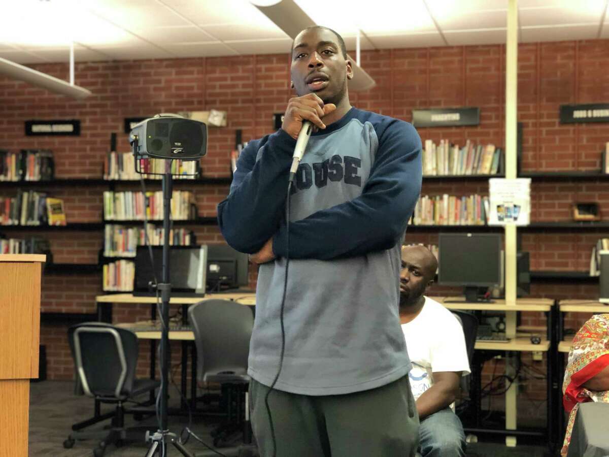 Residents came together to discuss how to address violence in New Haven Wednesday at the Stetson Library. Here, Chaz Stewart, the freshman basketball coach at James Hillhouse High School, speaks.