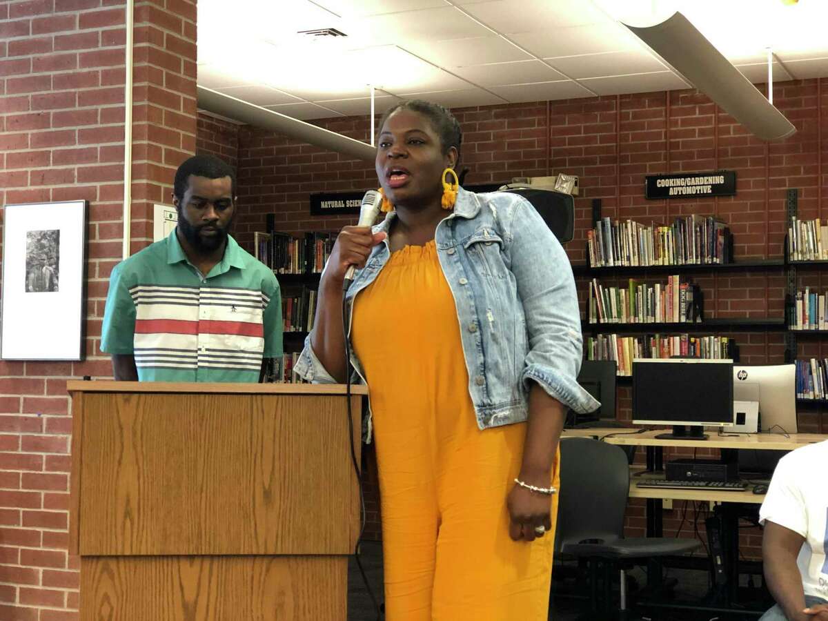 Residents came together to discuss how to address violence in New Haven Wednesday at the Stetson Library. Here, Nicole Huckaby speaks.