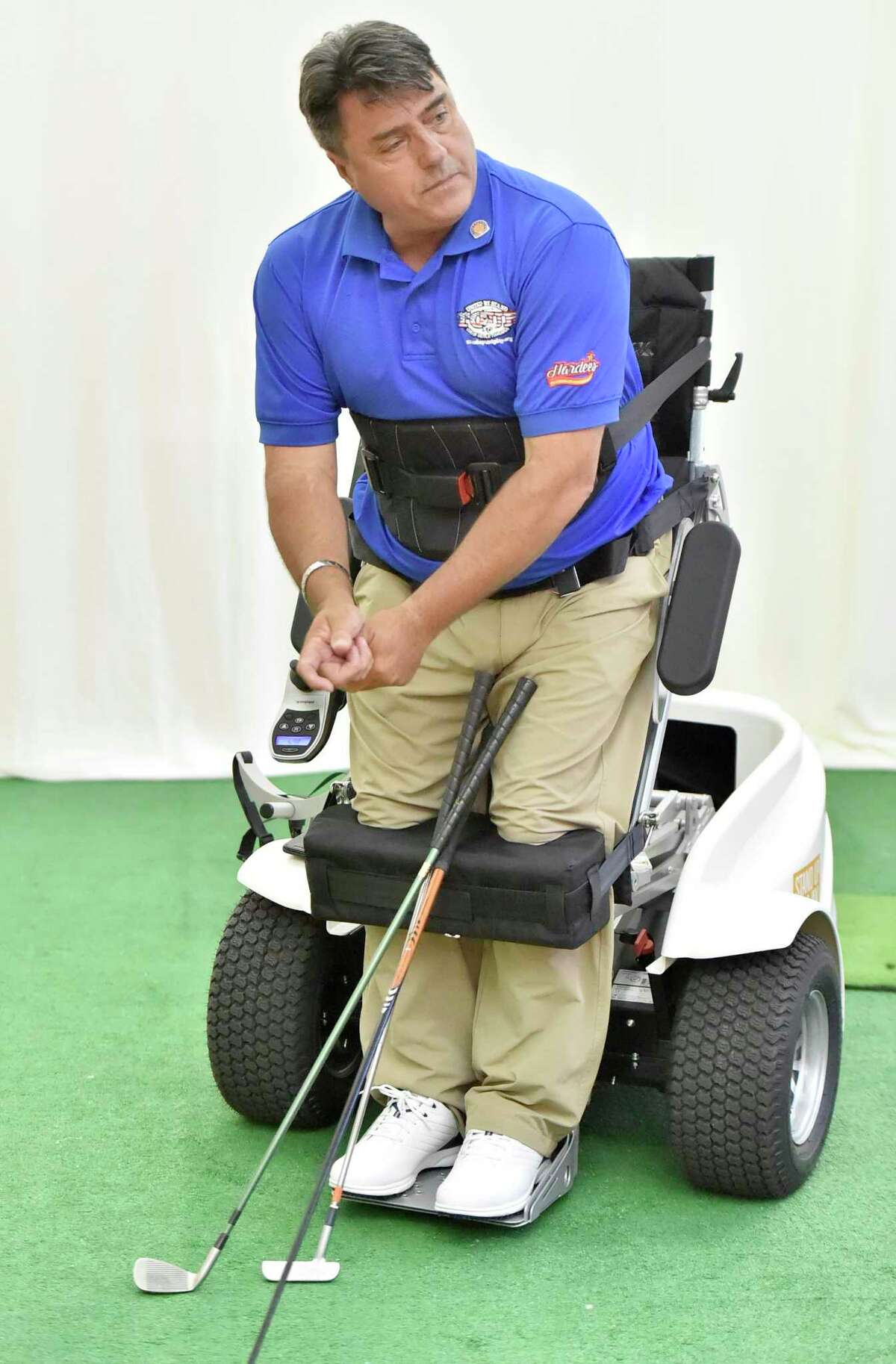 Anthony Netto, of Nevada, a former member of the South African Special Forces attached to the British Royal Marines who was shot and paralyzed in 1991 during the Gulf War, and is the founder of the Stand Up And Play Foundation and co-inventor of the Paramobile-Paragolfer, demonstrates the moving standing therapy mobile device Thursday that was recently acquired through donations by the Gaylord Hospital adaptive sports program in Wallingford. The Paramobile gives wheelchair users mobility and a standing therapy, providing a better quality of life. It functions as a rehabilitative aid, helps improve circulation, and respiration, reduces muscle spasticity, provides pressure relief on organs and minimizes occurrence of pressure sores.