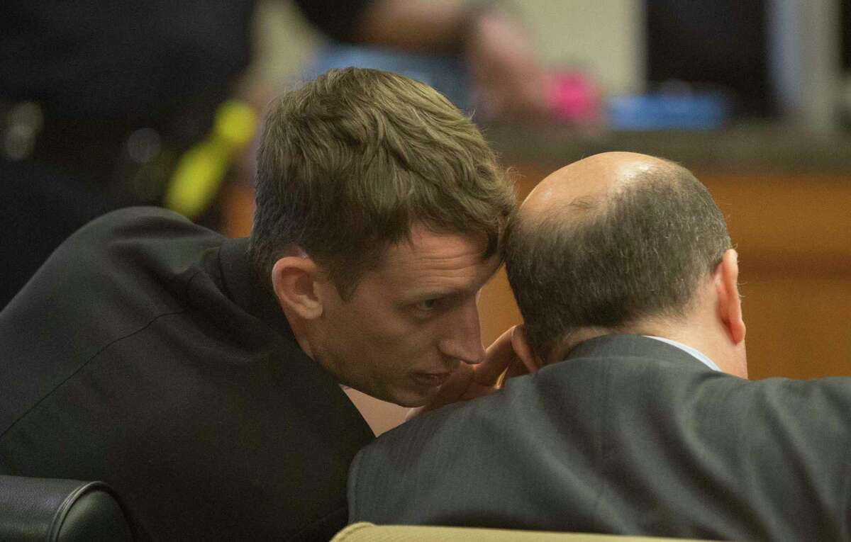 Marshall Schoen, 26, talks to his attorney David Adler while appearing to Harris County 232nd Criminal Court Judge Josh Hill on Thursday, July 18, 2019, in Houston. Schoen was accused of intoxicated manslaughter in the death of Mark Tartaglio, a University of Houston student, on April 14, 2016.