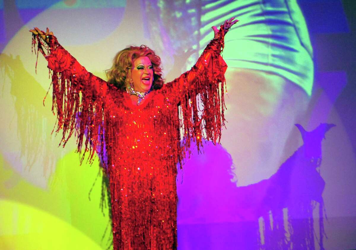 Above, Kenn Hopkins performs as Dolores Dégagé in the SameSex Variety Show & Benefit at the Bijou Theatre in downtown Bridgeport on Thursday during the 9th Annual Bridgeport Pride celebration. The variety show benefits the City Lights Gallery and WPKN radio. At right, Sariah Hassan, of Bridgeport, takes part in the Pride celebration. More photos on A4 and at ctpost.com.