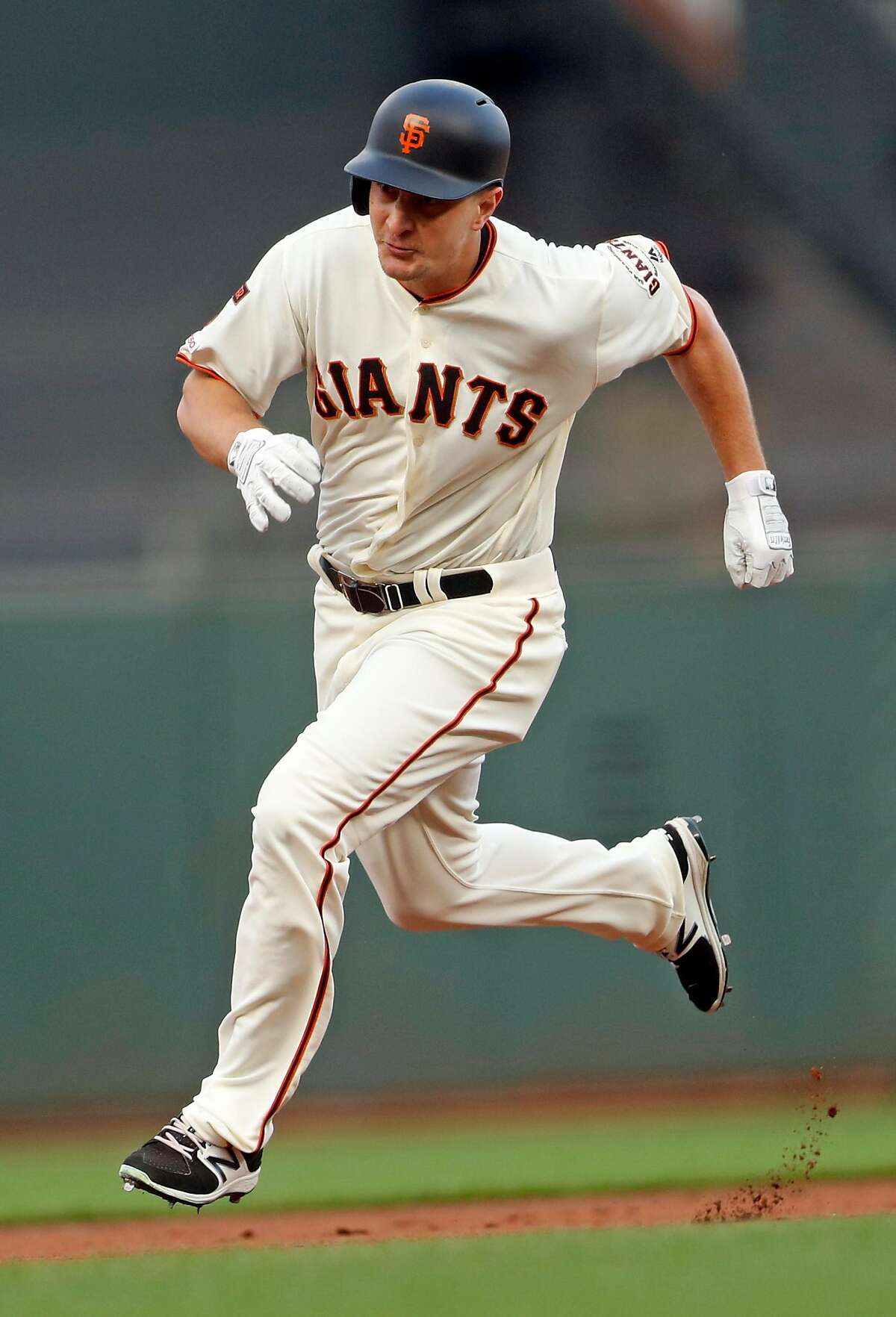 San Francisco Giants' Alex Dickerson legs outs a triple in 2nd inning against New York Mets during MLB game at Oracle Park in San Francisco, Calif., on Thursday, July 18, 2019.