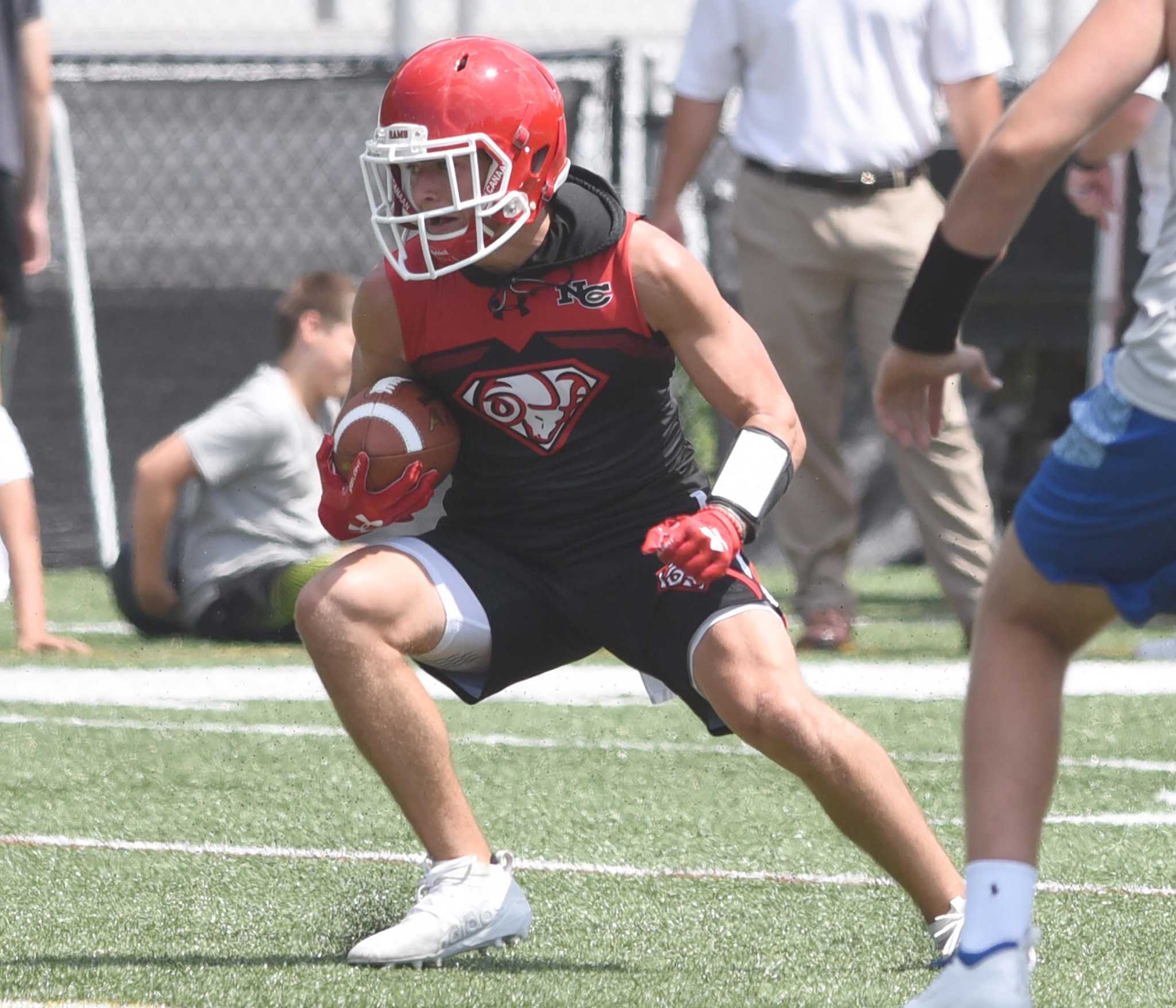New Canaan football stars at annual Grip It and Rip It tourney