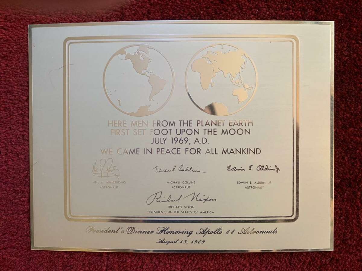 This replica plaque, similar to the one that was left on the moon's surface, is one of Eddie Ostrowski's prized possessions at his Shelton home.