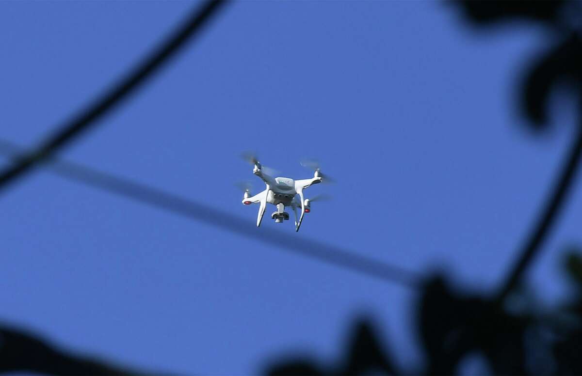 Beaumont Police use a drone to investigate Thursday's homicide at a home on Evalon Avenue early Friday morning. A body was found by the home's tenant around 8 p.m. when a broken window was discovered. A small fire was also reported. Photo taken Friday, 7/19/19